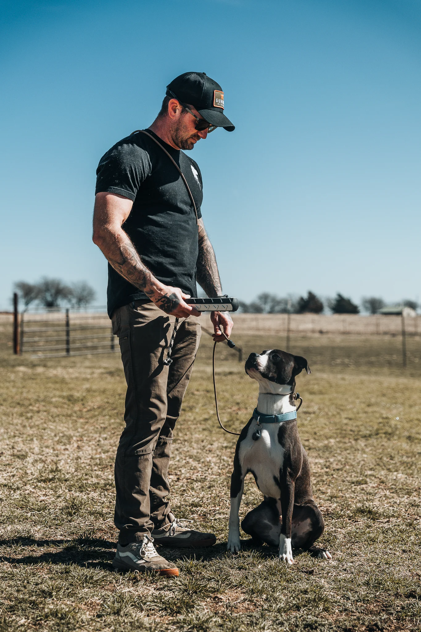 Professional dog trainer with happy dog